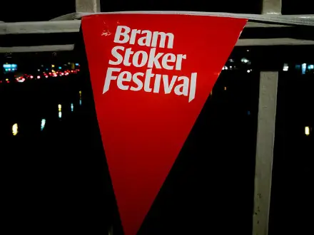 A triangle red sign with the writting, Bram Stoker Festival