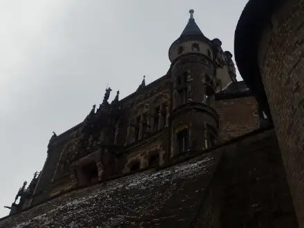 A close castle view from ground level on a rainy day