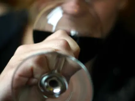 A woman drinking wine